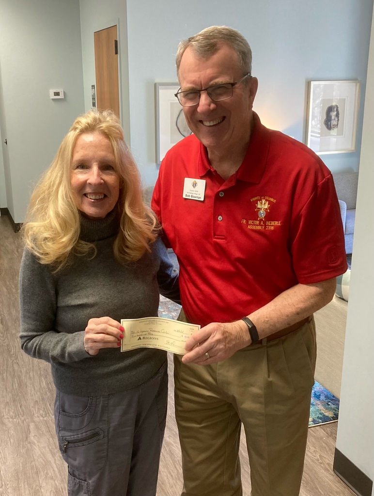 Brother Bob Bowman presenting a check to Nurse Ellen Bucolo 