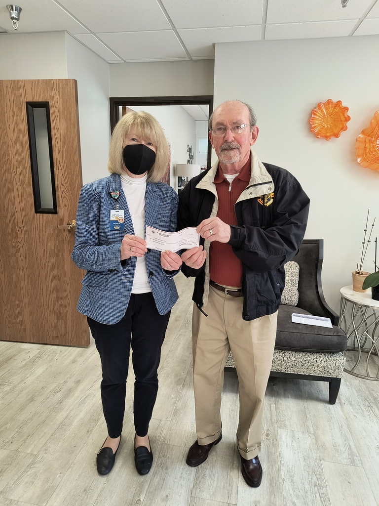 Sir Ed Doyle presenting check to Phyliss Hancock, Administrator of Good Samaritan 