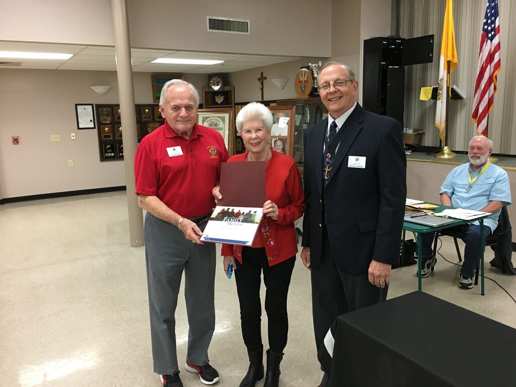 Grand Knight Murray Claassen presenting the Family of the Month Award to Bill and Kathleen Nosek