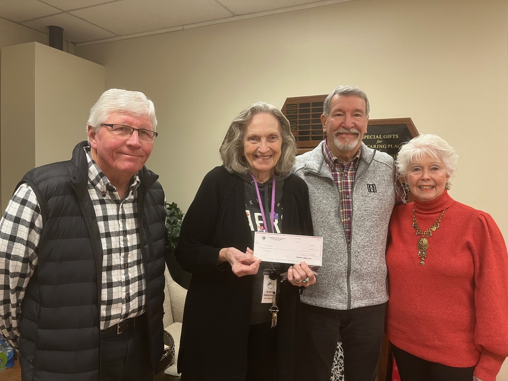 Pictured L-R Brother Bill Taylor, Betty Bourdreaux, Grand Knight Gary Wolfer, Ruth Wolfer