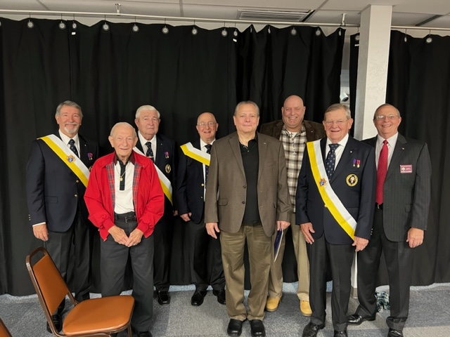 Pictured from left to right: GK Gary Wolfer; Brother Knight Joseph Radzikowski; Brother Knight Tom Donnelly; Brother Knight Gerald Krawczynski; Brother Knight Todd Norlin; Brother Knight Troy VreNon; Brother Knight Bill Patterson; Districk 10 Deputy Murray Claassan