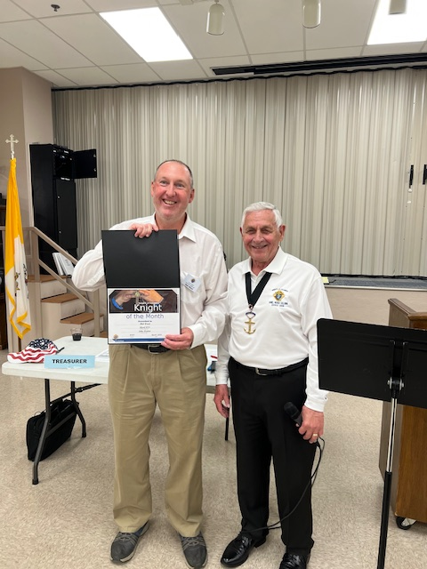 Bob Ward receiving the Knight of the Month Award from GK John Weidert